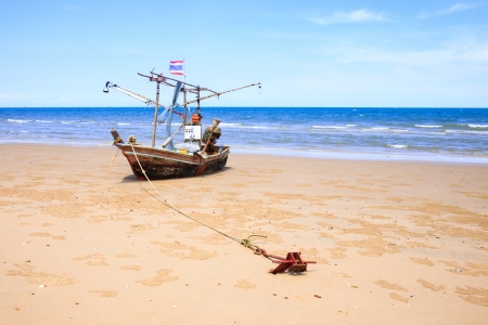 Traditional fishing boat on the beachの写真素材