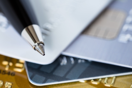 Pen on credit stack of cards low dept of fieldの写真素材