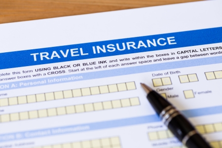 Travel insurance application form with pen concept for travel planningの写真素材