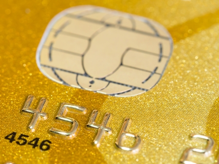 Gold credit card with micro chip selective focusの写真素材