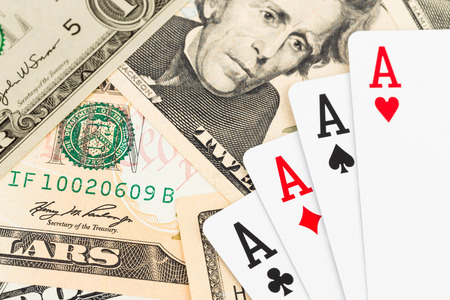 Four aces on dollar banknote