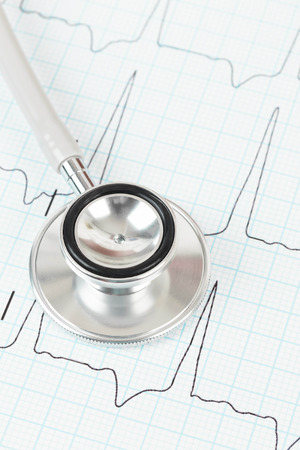 Stethoscope on cardiogram concept for heart careの写真素材