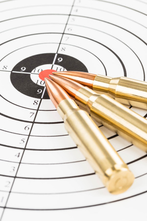Rifle bullet over target background