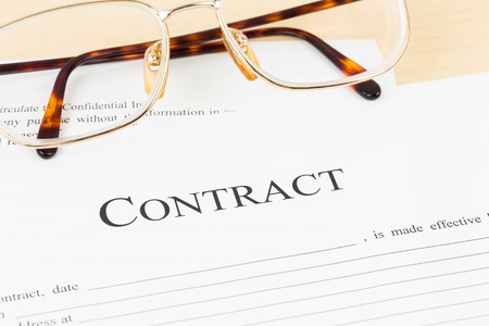 Business contract document with glassesの写真素材