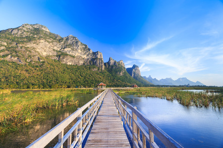 Wooden bridge over a lake in Sam Roi Yod National Park, Prachuap Khiri Khan, Thailandの写真素材