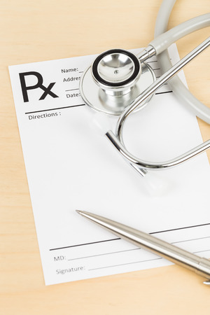 Blank prescription, stethoscope, and medicineの写真素材