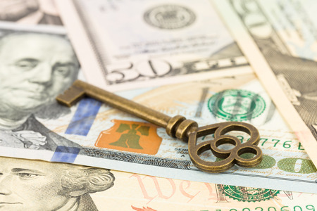 Antique key on dollar banknote concept for successの写真素材