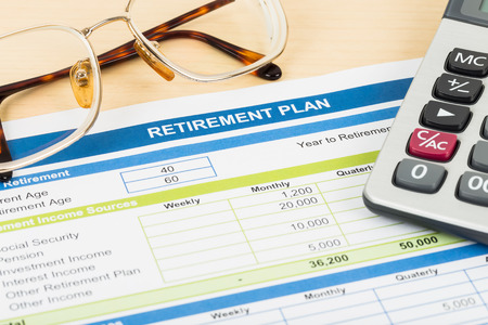 Retirement plan with glasses and calculator document is mockupの写真素材