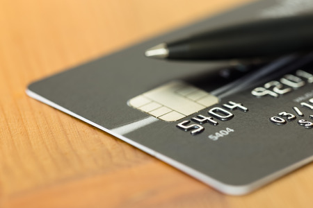 Pen on black credit card