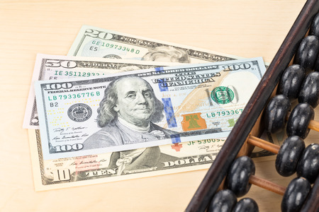 Old abacus with  us dollar banknoteの写真素材