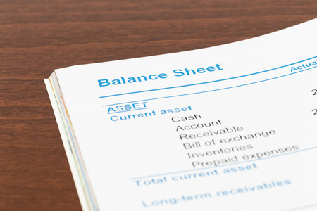 Balance sheet in stockholder report book, document is mock-upの写真素材