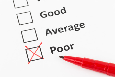Customer satisfaction survey checkboxand pen with poor tickの写真素材