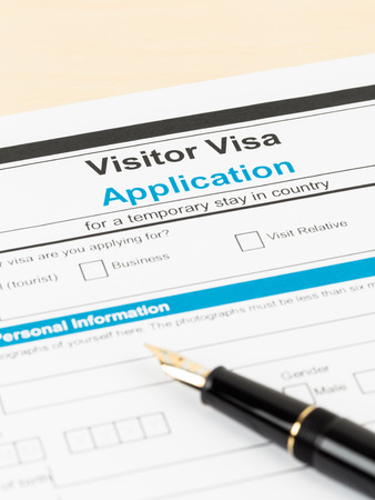 Visa application form with pen; form is mock-upの写真素材