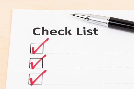 Checklist paper with tick mark and penの写真素材