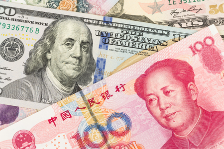 US Dollar and Chinese Yuan banknote moneyの写真素材