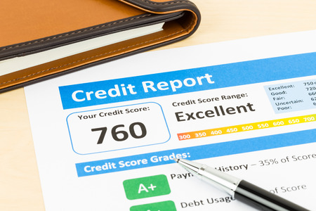 Credit score report with pen and organizer bookの写真素材