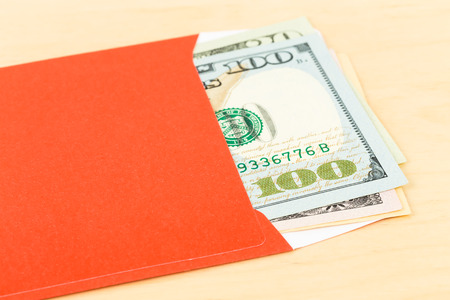 Money dollar in red envelopeの写真素材
