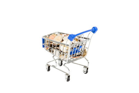 Shopping cart full of coin on white backgroundの写真素材