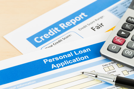 Personal loan application form fair credit score with calculator, and penの写真素材
