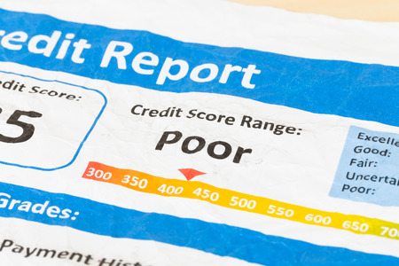 Poor credit score report on wrinkled paperの写真素材