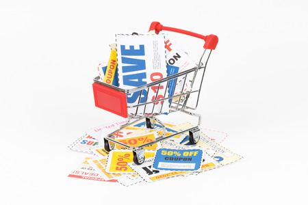 Saving discount coupon voucher in shopping cart, coupons are mock-upの写真素材
