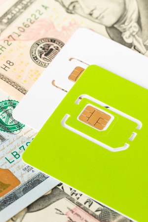 Sim card on dollar money banknoteの写真素材