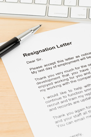 Resignation letter resign with pen and keyboardの写真素材
