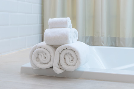White towel roll in hotel resort bathtubの写真素材