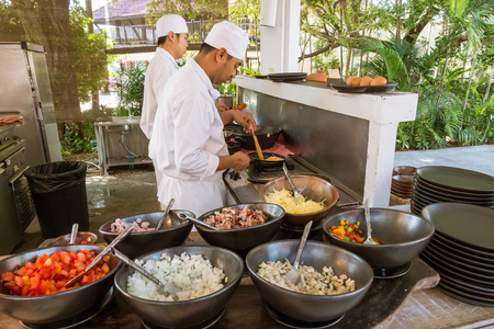 Prachuap Khiri Khan, Thailand - May 8, 2018: Chefs were cooking at egg station to prepare breakfast for guests in the hotel.のeditorial素材