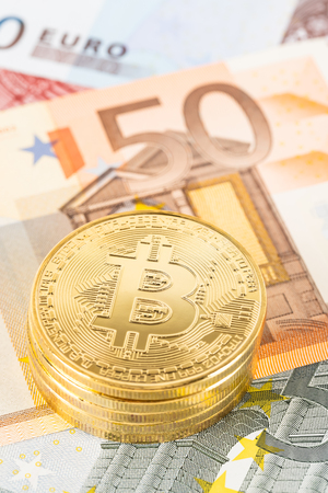 Bitcoin token on euro banknote moneyの写真素材