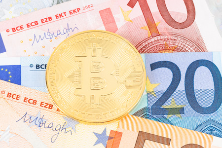 Bitcoin token on euro banknote moneyの写真素材
