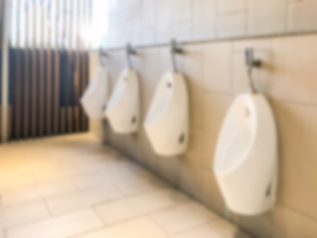 Blur abstract men toilet urinals in a public restroomの写真素材