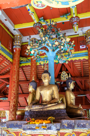 Lampang, Thailand - December 28, 2018: Four Buddha sculpures in pavilion at Wat Pong Sanuk temple and museum in Lampang, North of Thailandの写真素材