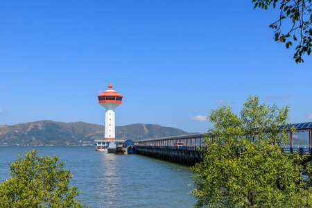 Lighthouse on Andaman sea, custom and immigration office at border to Myanmar, Ranong, Thailand.の写真素材
