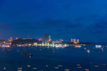 Pattaya bay beach harbor, famous seaside resort city, during twilight, Chonburi, Thailand