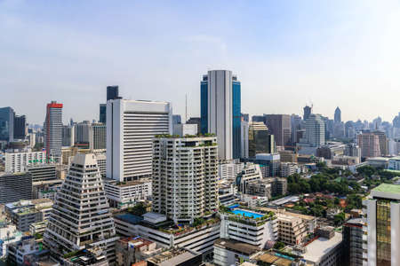 Silom district with buildings and skyscrapers, famous business center in Bangkok during sunny day, Thailandのeditorial素材