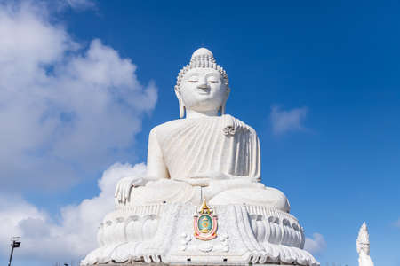 Phuket, Thailand - Febryary 14, 2020: Big marble Buddha statue on top of Nagakerd Mountain. Famous destination for pilgrim and tourist.のeditorial素材
