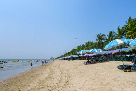 Chonburi, Thailand - March 22, 2019: Beach umbrella for rent at Bang Saen, famous beach for local tourists near Bangkok.のeditorial素材