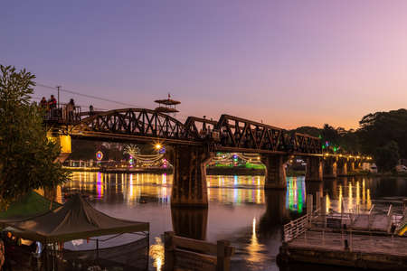 Kanchanaburi, Thailand - November 26, 2019: The bridge of the Thai-Burma Railway (or Death Railway) crosses the Khwae Yai River at Kanchanaburi, constructed by Japanese military and prisoner of war. Now it become famous international tourist landmark destのeditorial素材