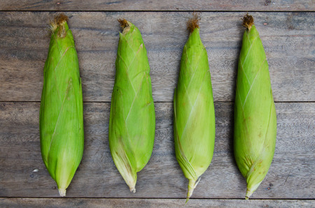 Fresh Corn In The Green Cob On The Wood Table.の写真素材