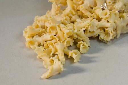 Gigli Pasta Comes Out of Plastic Bag.