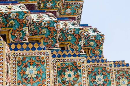 Thai Ornamental Pattern in Traditional Style is Decorated with Colorful Ceramic at Stupa of Wat Pho Monastery at Bangkok, Thailand.の写真素材