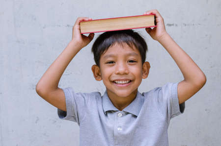 Asian Child Feel Happy with a Book.の写真素材