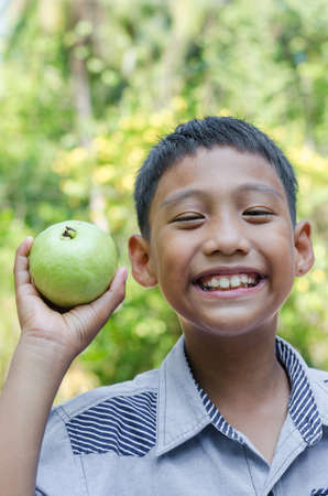 Asian Child is Enjoy Eating Fruits.の写真素材