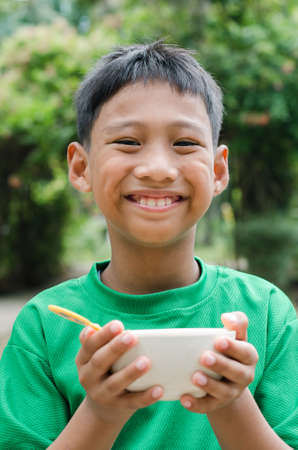 Asian Child is Eating the Breakfast.の写真素材
