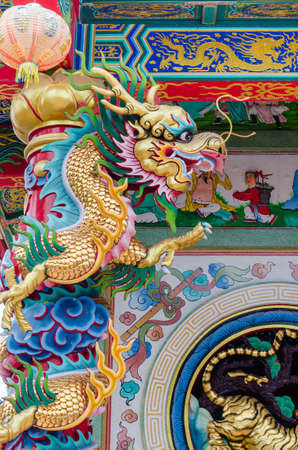 Colorful Dragon Statue is Decorate on the Chinese Shrine Building.の写真素材