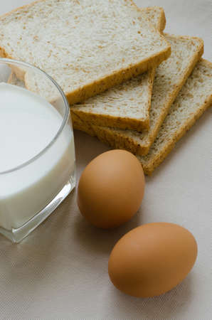 Sliced Whole Wheat Bread, Boiled Egg and Milk for Breakfast.の写真素材