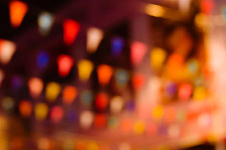 Bokeh of Festival Flags Hanging on the Festival Night in Blurry Background.