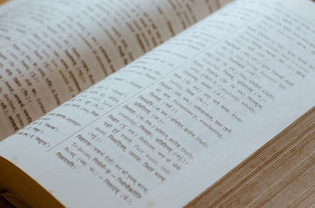 Old Dictionary of Hindi-English Language Open in Soft Focus.の写真素材