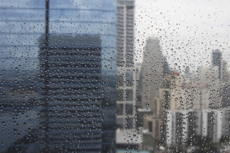 Water drops on clear glass after heavy rainの写真素材